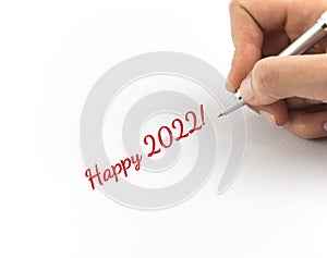 Hand writing `Happy 2022!` .