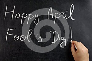 Hand writing Happy April fool s day blackboard chalkboard