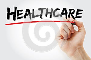 Hand writing Healthcare with marker, health concept background