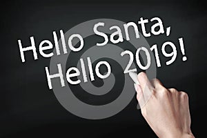 Hand writing hello santa and hello 2019