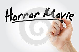 Hand writing Horror movie with marker