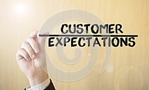 Hand writing inscription Customer Expectations, with marker,business concept