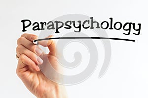 Hand writing inscription Parapsychology with marker, concept