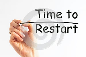 Hand writing inscription TIME TO RESTART with marker, concept, stock image