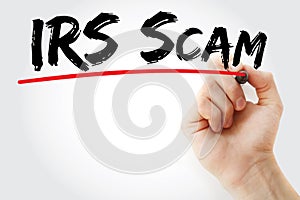 Hand writing IRS Scam with marker, concept background