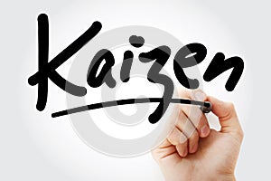 Hand writing Kaizen with marker