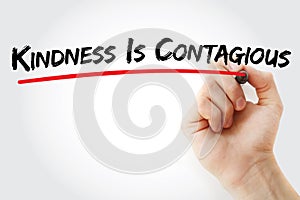 Hand writing Kindness Is Contagious with marker, health concept background