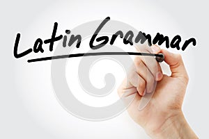 Hand writing Latin grammar with marker