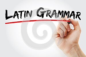 Hand writing Latin grammar with marker