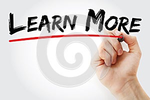 Hand writing Learn More with marker, concept background