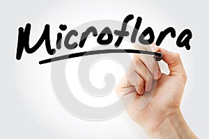 Hand writing Microflora with marker