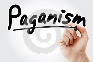Hand writing Paganism with marker