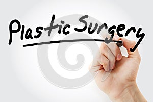Hand writing Plastic surgery with marker