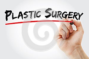 Hand writing Plastic surgery with marker