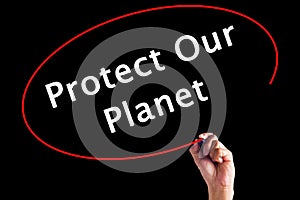 Hand Writing Protect Our Planet with a marker over transparent b