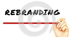 Hand writing REBRANDING with red marker. Isolated on white background