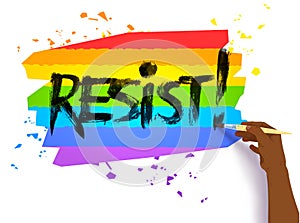 Hand writing Resist slogan on lgbt flag