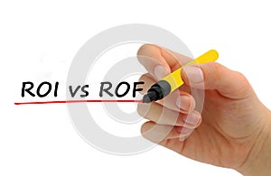 Hand writing ROI vs ROF with red marker