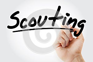 Hand writing Scouting with marker