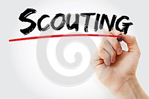 Hand writing Scouting with marker