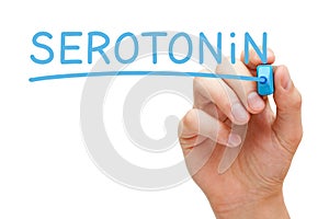 Hand Writing Serotonin With Blue Marker photo