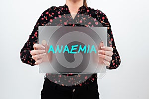 Hand writing sign Anaemia. Word for a condition marked by a deficiency of hemoglobin in the blood