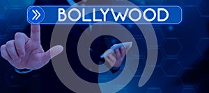 Hand writing sign Bollywood. Business showcase one who organizes and assumes the risks of a business Businessman in suit
