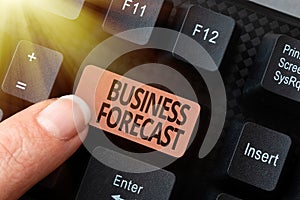 Hand writing sign Business Forecast. Business overview estimate or prediction of future developments in business