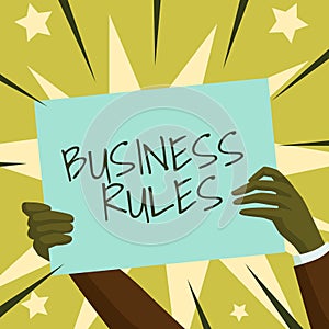 Hand writing sign Business Rules. Word for a specific directive that constrains or defines a business Hands Holding