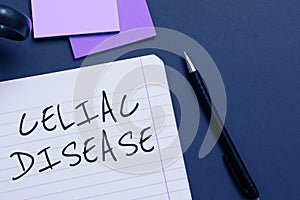 Hand writing sign Celiac Disease. Internet Concept Small intestine is hypersensitive to gluten Digestion problem