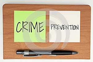 Hand writing sign Crime Prevention. Conceptual photo Federal Offense actions Illegal Activities punishable by Law