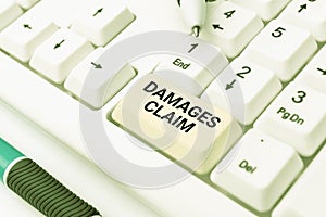 Hand writing sign Damages Claim. Business overview Demand Compensation Litigate Insurance File Suit Typing Online Member