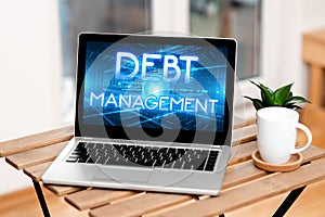 Hand writing sign Debt Management. Word for The formal agreement between a debtor and a creditor Laptop Resting On A