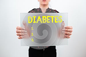 Hand writing sign Diabetes. Business approach any of various abnormal conditions characterized by excretion