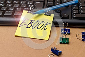 Hand writing sign E Book. Business concept electronic version of printed book which can read computer or tablet Multiple