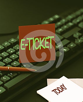 Hand writing sign E Ticket. Business idea Digital ticket that is as valid as a paper ticket or its equivalent Inputting