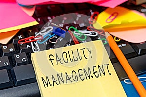 Hand writing sign Facility Management. Concept meaning maintenance of an organization s is buildings and equipment