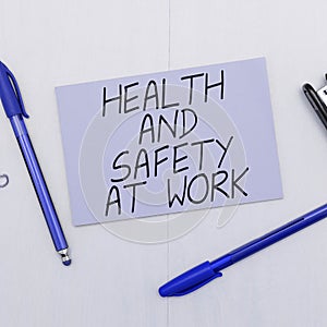 Hand writing sign Health And Safety At Work. Word for Secure procedures prevent accidents avoid danger