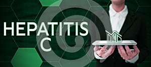 Hand writing sign Hepatitis C. Business overview Inflammation of the liver due to a viral infection Liver disease