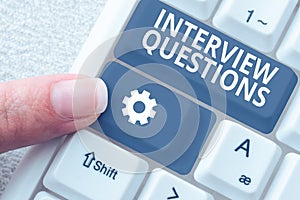 Hand writing sign Interview Questions. Business concept Typical topic being ask or inquire during an interview