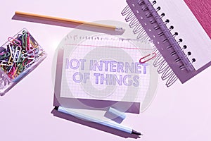 Hand writing sign Iot Internet Of Things. Word Written on Network of Physical Devices send and receive Data