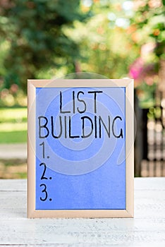 Hand writing sign List Building. Conceptual photo database of people you can contact with your marketing message