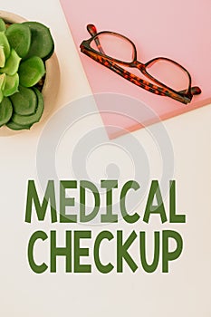 Hand writing sign Medical Check Up. Concept meaning Thorough physical examination to test state of health Office