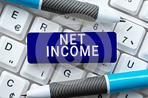 Hand writing sign Net Income. Conceptual photo the gross income remaining after all deductions and exemptions are taken