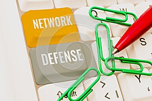 Hand writing sign Network Defense. Internet Concept easures to protect and defend information from disruption