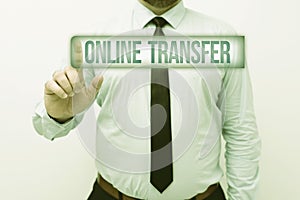 Hand writing sign Online Transfer. Business concept authorizes a fund transfer over an electronic funds transfer photo