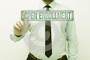 Hand writing sign Open Enrollment. Business concept policy of allowing qualifying students to enroll in school