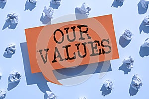 Hand writing sign Our Values. Business approach list of morals companies or individuals commit to do them