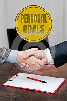 Hand writing sign Personal Goals. Word Written on Target set by a person to influence his efforts Motivation Two