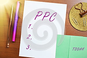 Hand writing sign Ppc. Word for payperclick way of using search engine advertising to generate clicks